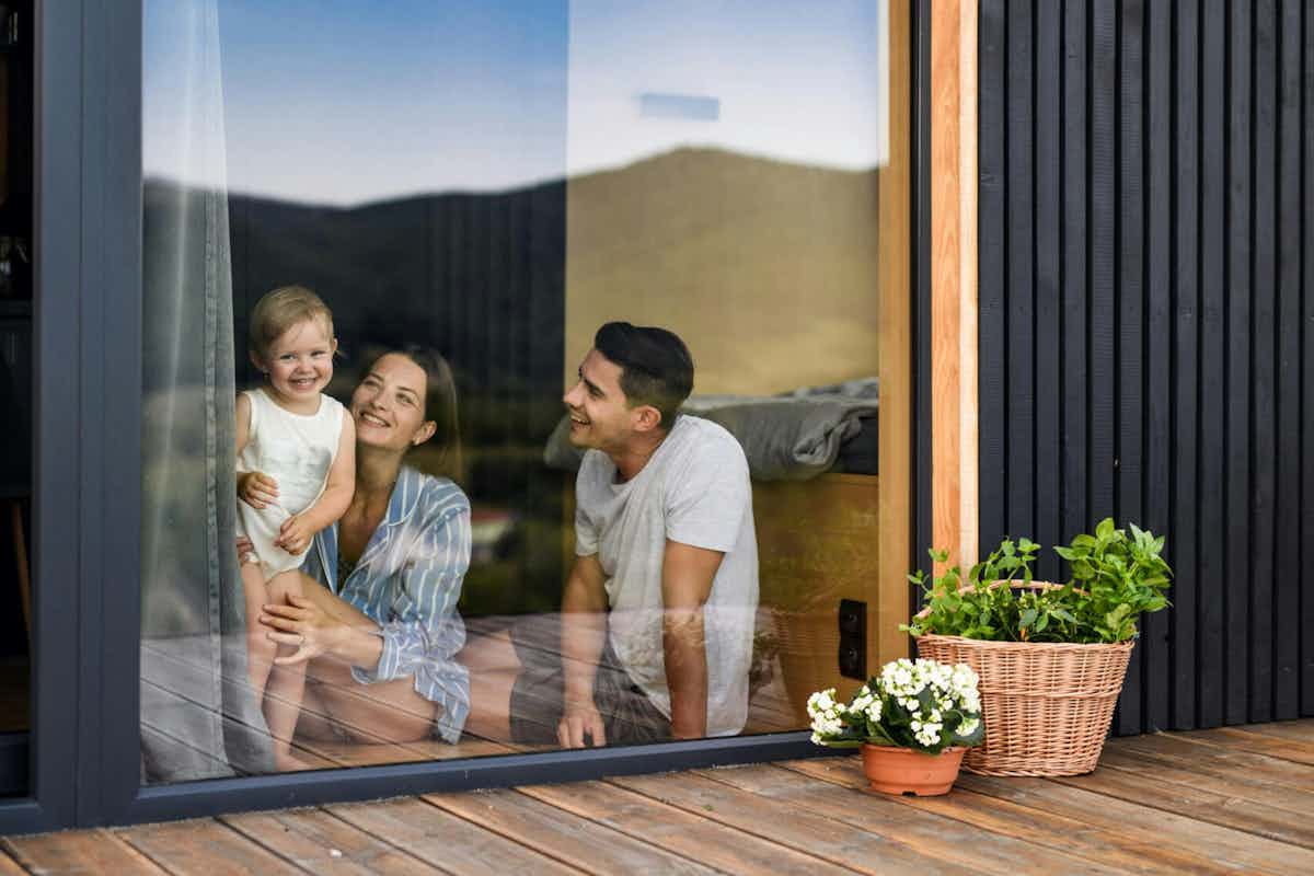 family overlooking replaced window glass